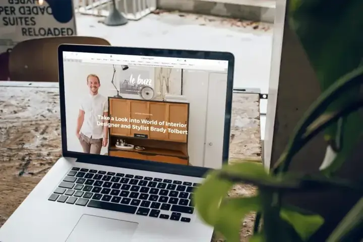 Website rendered on a MacBook on a work desk